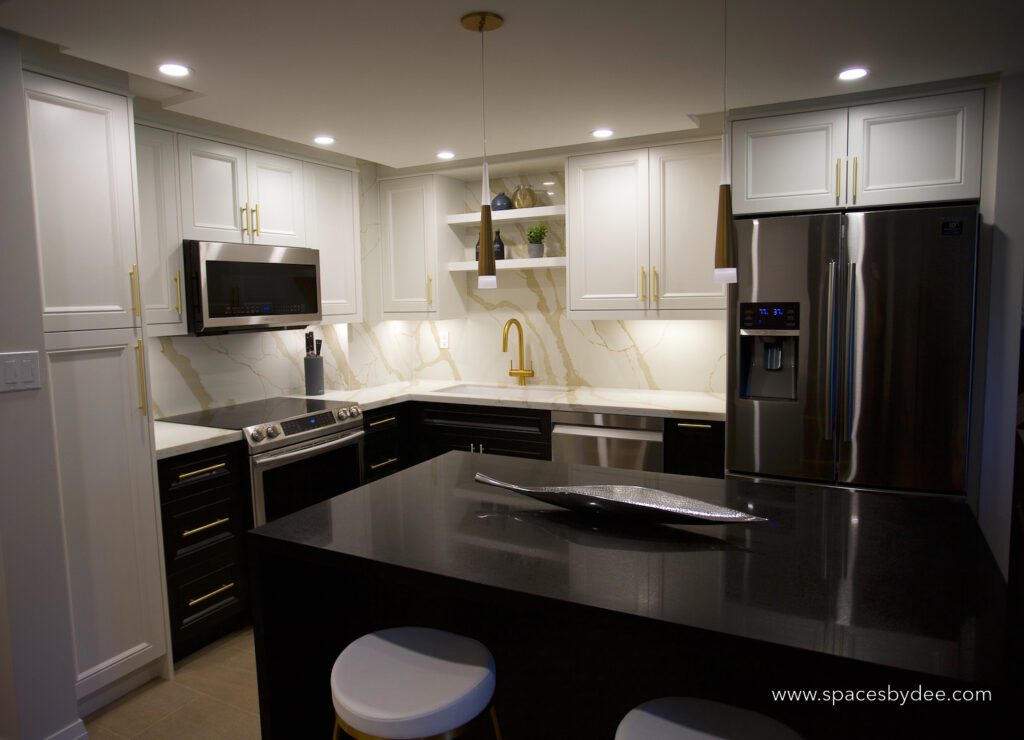 small contemporary black and white condo kitchen with gold accents.