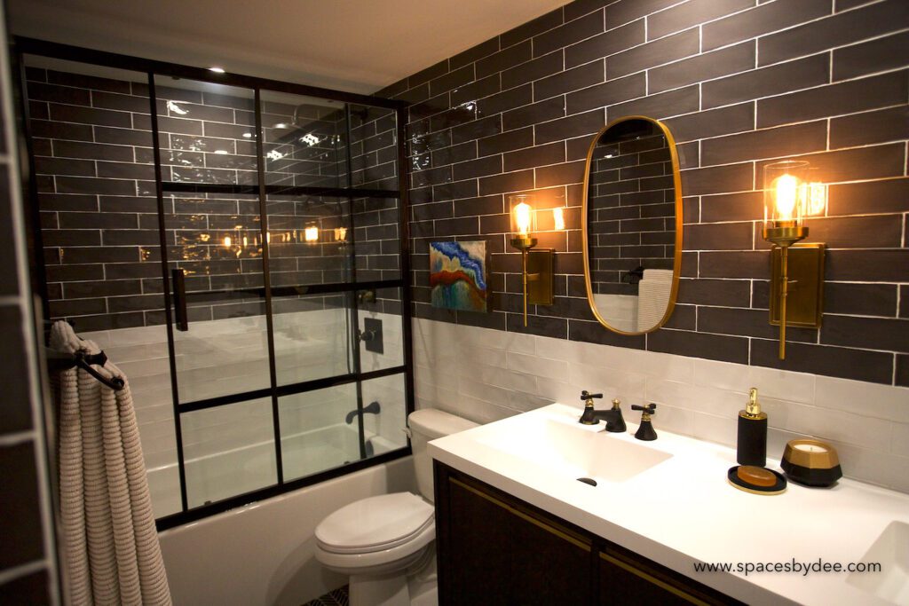 classy bold bathroom with black, gold and white elements.