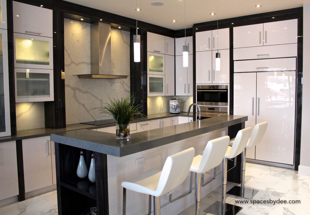 super modern large white, black and grey minimalistic kitchen with stone backsplash.